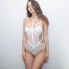 Semi-transparent mesh bodysuit with leather straps tied around the neck